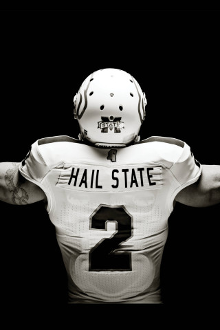 Football player arms out helmet - a football player free wallpaper