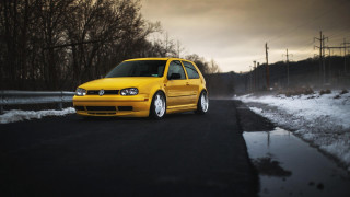 Yellow car snow road trees - a dark sky free wallpaper