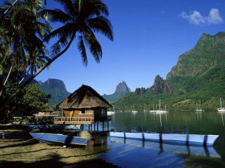 Boat docked tropical resort mountains - the water free wallpaper