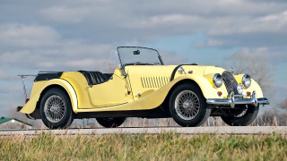 Yellow car parked road building - the side of the road in front free wallpaper