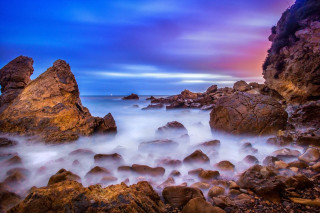 Rocky beach water cloudy sky - a rocky beach free wallpaper