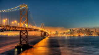 Bridge water city lights night - a city in the foreground free wallpaper
