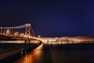 Bridge water city night lights 35 - a city in the foreground free wallpaper
