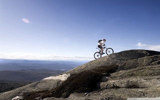 Mountain biking scenery beach sky - a man riding free wallpaper