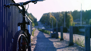 Bike parked fence roadside trees - a fence free wallpaper