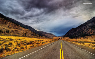 Long road mountain cloudy sky 4 - a yellow line free wallpaper