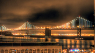 Bridge water night lights cloudy - a cloudy sky free wallpaper