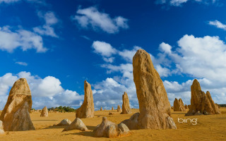Desert rocks blue sky clouds - a group of rocks free wallpaper