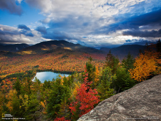 Lake trees mountains cloudy sky 2 - tree and mountains under a cloudy sky free wallpaper
