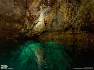 Man climbing ladder cave water - a body of water free wallpaper