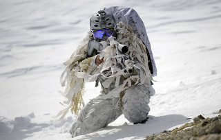 Man snow suit climbing hill - free bikini wallpaper