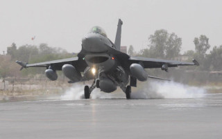 Jet taking off smoke wings - gear free wallpaper