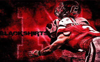 Football player uniform holding ball 6 - a football player free wallpaper