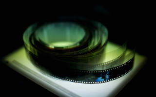 Filmstrip blurry camera lens white - a film strip free wallpaper