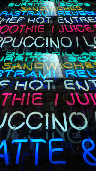 Neon sign multilingual colors wall - international typographic style free wallpaper