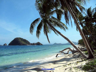 Beach boat palm trees mountain 2 - a mountain in the distance free wallpaper