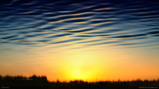 Sunset plane flying clouds building - a building in the foreground free wallpaper