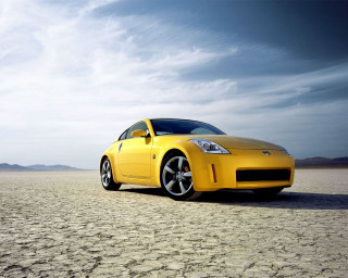 Yellow sports car desert sky - a desert area free wallpaper