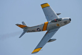 Fighter jet blue sky yellow - f 8 aperture free wallpaper