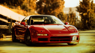 Red sports car autumn road - a fence and trees free wallpaper