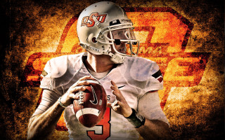 Football player holding ball grunge - gritty free wallpaper