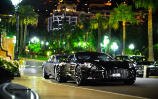 Black sports car night building - palm tree free wallpaper