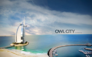 Tall building ocean sky beach - chris labrooy free wallpaper