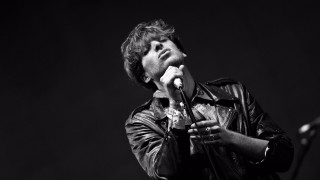 Man holding microphone stage speaking - a stage free wallpaper