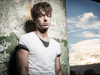 Man standing wall sky background - david boyd free wallpaper