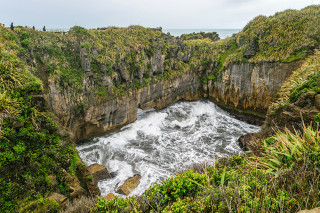 Large water vegetation cliffs cloudy - a large body of water free wallpaper