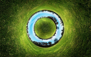 Circular grassy field blue pond - a grassy field free wallpaper