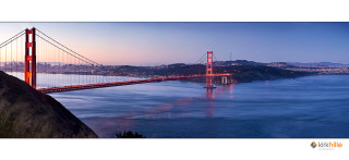 Long bridge water dusk city - over a large body of water free wallpaper
