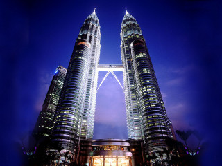 Tall buildings night city lights - night time in a city free wallpaper