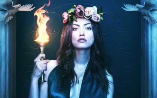 Woman holding candle flower crown - evaline ness free wallpaper