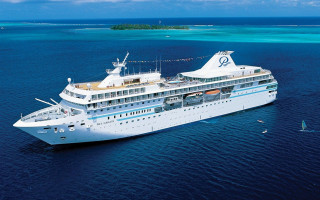 Cruise ship ocean island background - a small island in the background free wallpaper