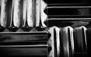 Metal closeup black white background - hard surface free wallpaper