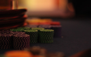 Poker chips table cards person - a person in the background free wallpaper