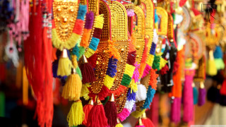 Colorful tassels hanging wall storefront - a wall free wallpaper