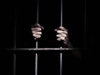 Person holding jailcell bars dark - douglas robertson bisset free wallpaper