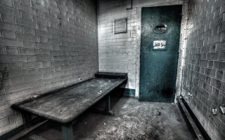 Bench room door brick wall - a bench in a room free wallpaper