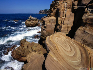 Rocky cliff waves ocean boat - a cliff face free wallpaper