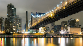 Bridge river city skyline night - a city skyline in the background free wallpaper
