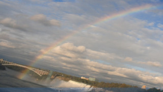 Rainbow waterfall bridge boat nature - a boat in the foreground free wallpaper