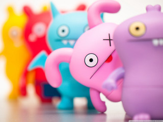 Toy figures colorful blurry bokeh - a microscopic photo free wallpaper