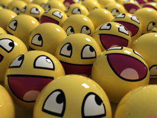 Yellow balls with faces painted - cheerful free wallpaper