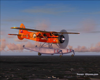 Small plane flying water sky - over a body of water free wallpaper