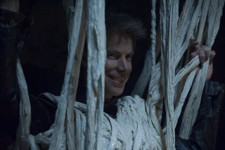 Smiling man holding rope structure - smiling free wallpaper
