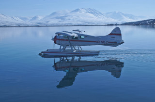 Small plane floating water mountain - reflection free wallpaper