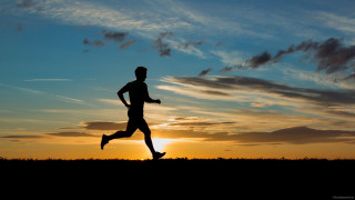 Man running sunset sky background - the sun setting behind free wallpaper