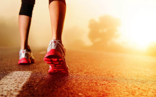 Person walking red shoes yellow - a yellow background behind them free wallpaper